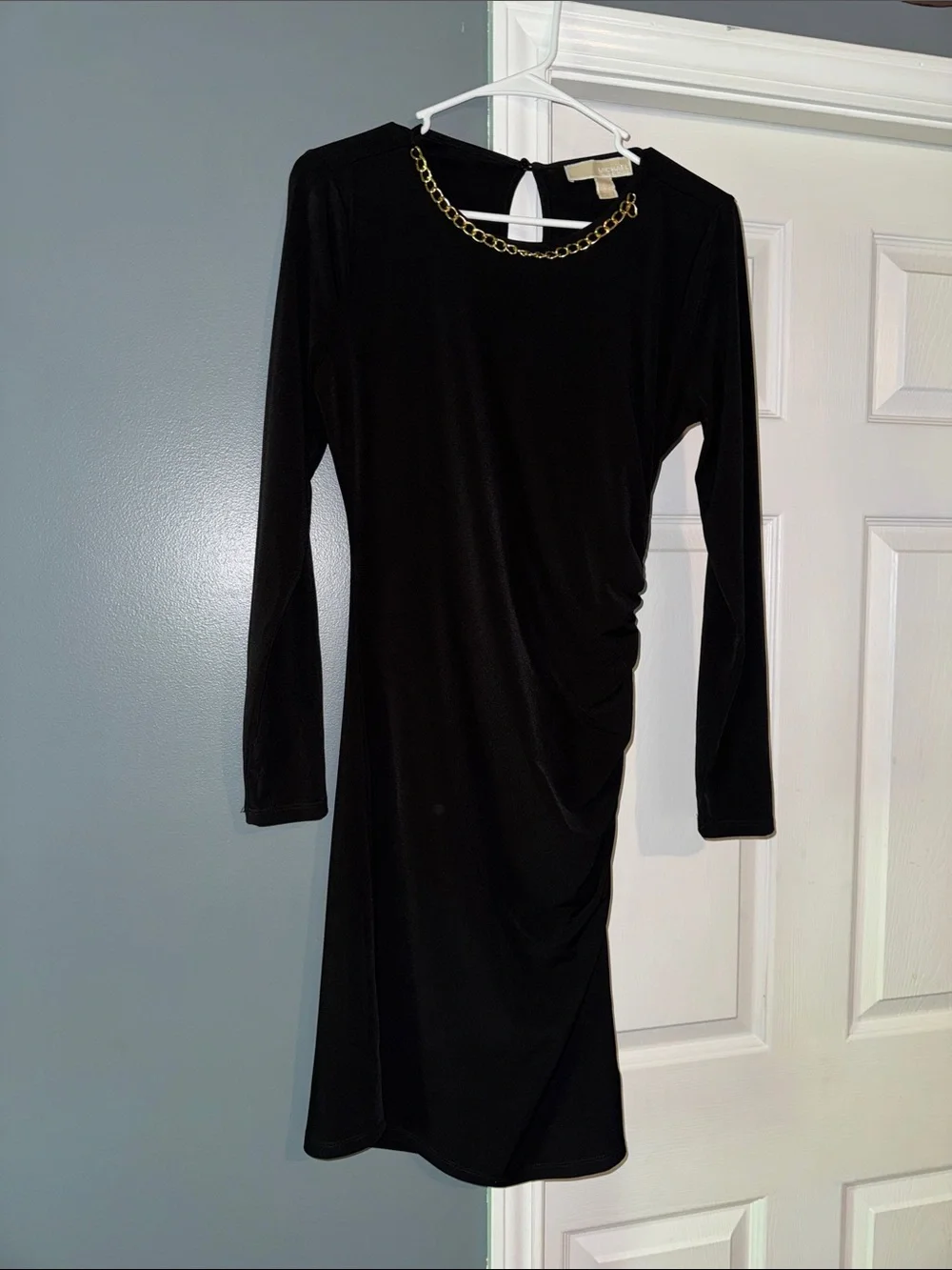 Beautiful black dress with gold accent on neck line